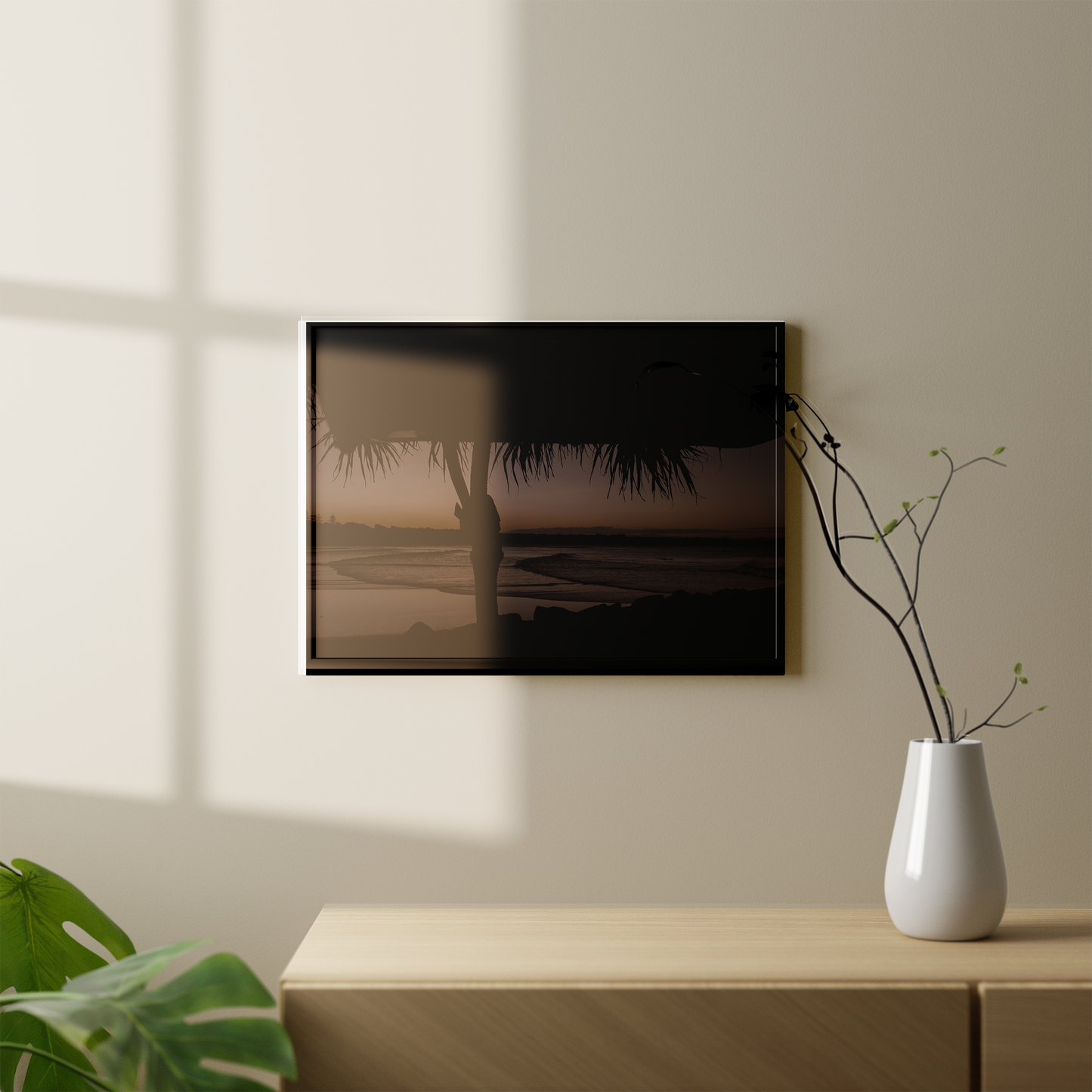 an image of sunset at at the beach with the silhouette of a palm tree in frame, shot in Australia by Steffi Jade